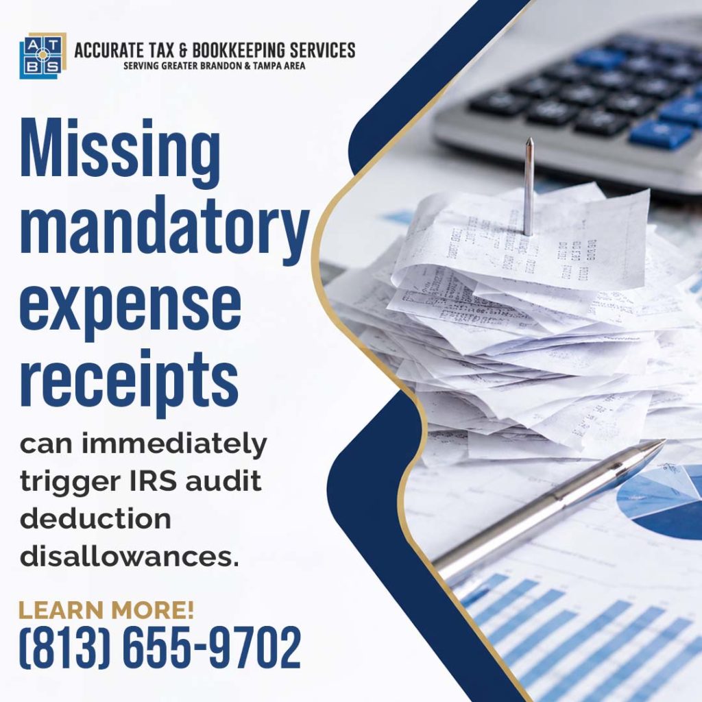A stack of paper business receipts on a metal spindle beside an office calculator, pen, and financial charts with text warning about IRS audit deduction disallowances.
