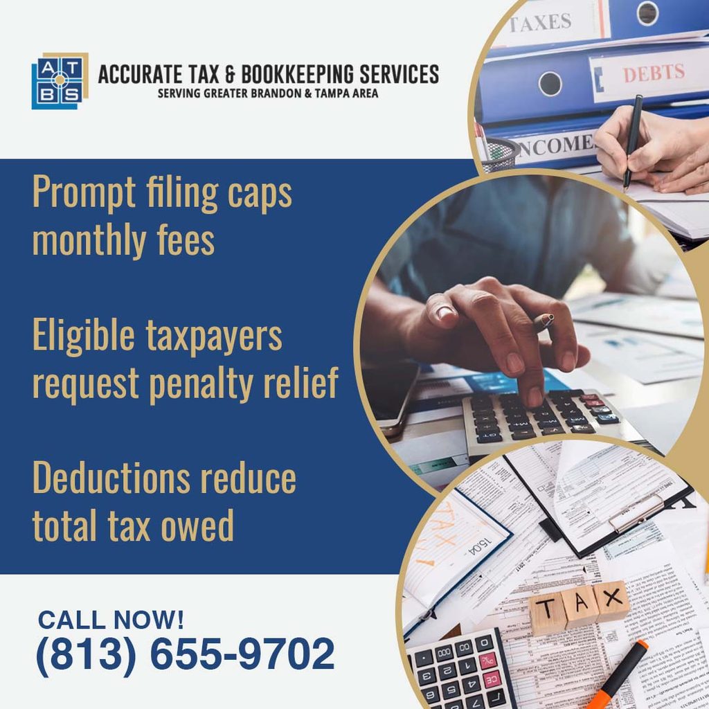 Tax forms, binders, and a calculator on a desk, representing IRS penalty relief and tax deductions for taxpayers